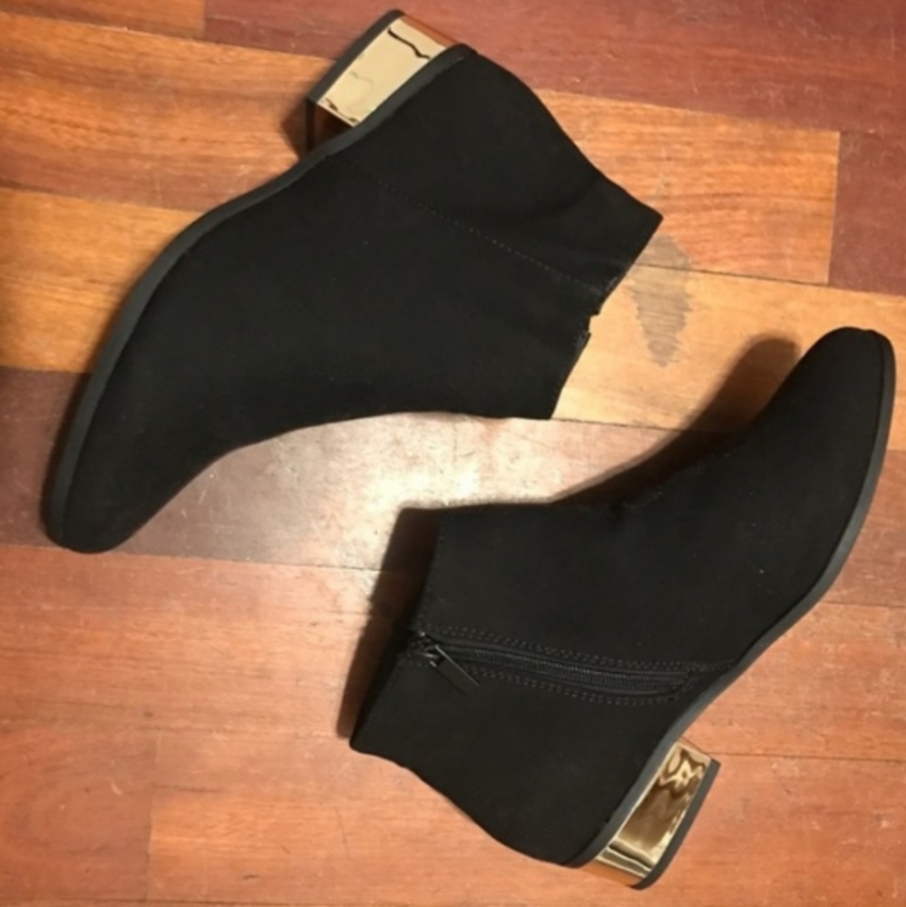 Black booties with gold heels